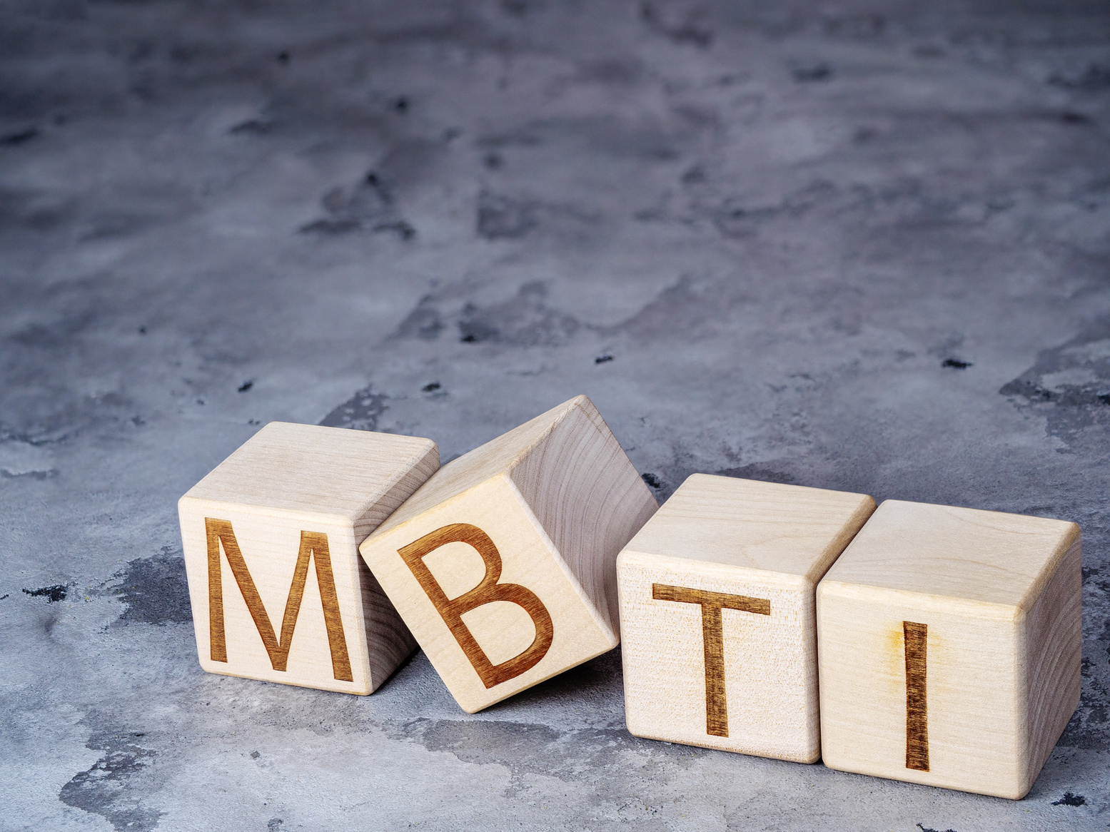 MBTI text on wood blocks as concept of psychological testing for career and personal growth